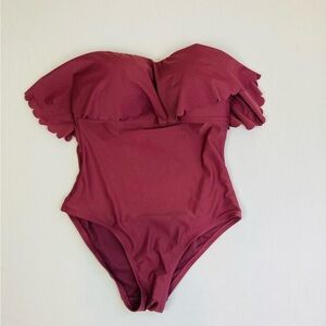 NWT Kona Sol one piece ruffle strapless swimsuit in a mauve color. Size 8-10